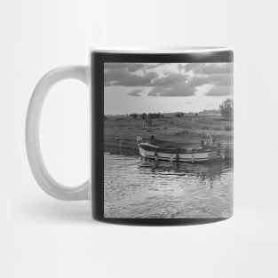 Wooden boat moored in Thurne Dyke in the Norfolk Broads National Park Mug